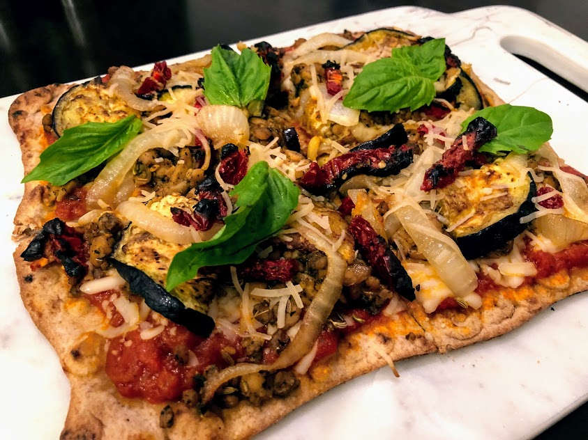 Tempeh "Sausage", Caramelized Onion, Roasted Eggplant, and Sundried Tomato Pizza on Whole Wheat Lavash